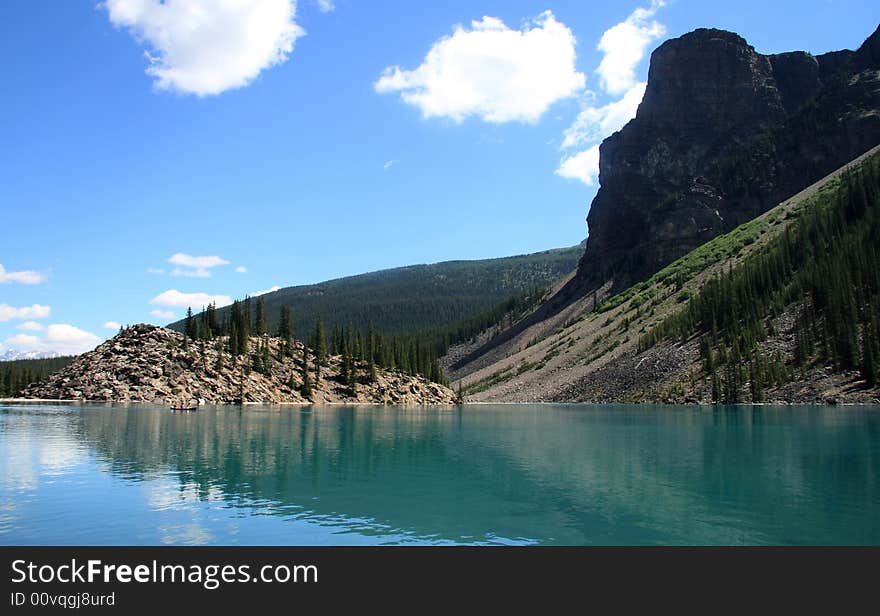 Amazing crystal blue lake reflecting the surrounding scenery in the Canadian Rockies. Amazing crystal blue lake reflecting the surrounding scenery in the Canadian Rockies