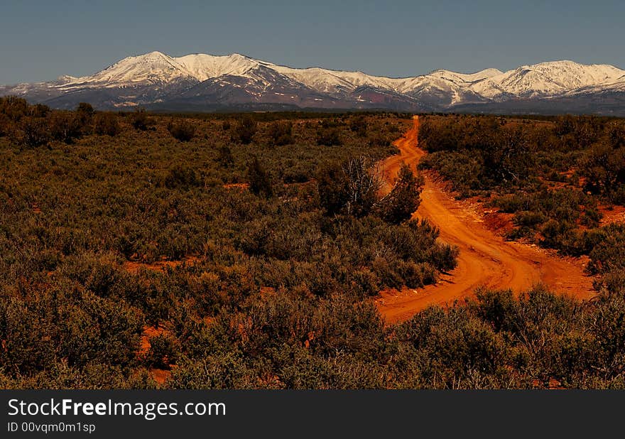 Nice image of a dirt road to the mountains
