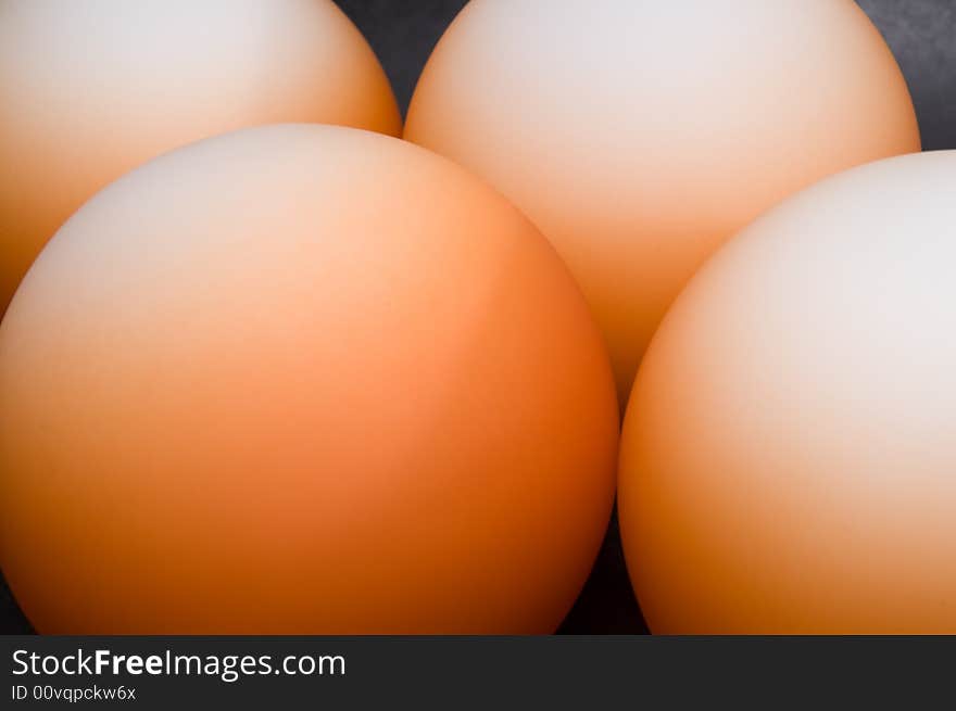 Abstract pattern of orange balls on black background