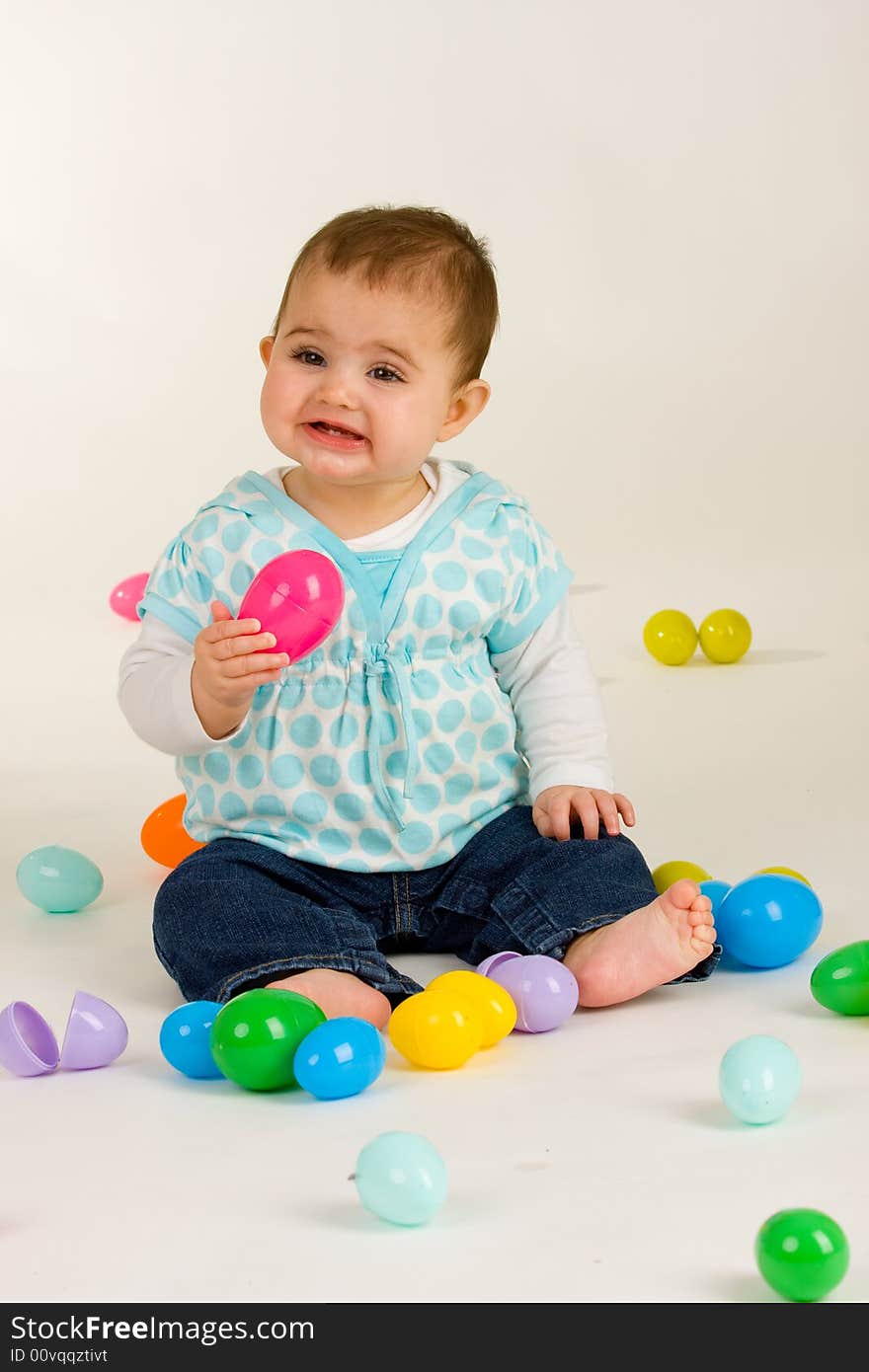 Cute baby girl with easter plastic eggs. Cute baby girl with easter plastic eggs