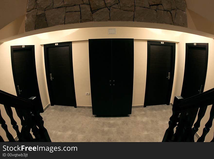 A dark and little room with many doors