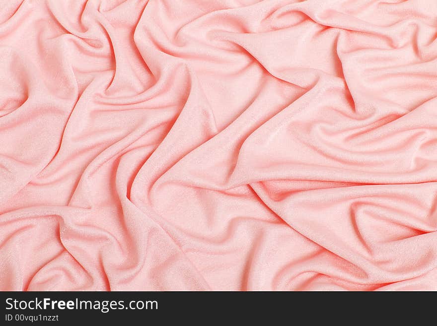 Pink textiles collected pleated, a background. Pink textiles collected pleated, a background