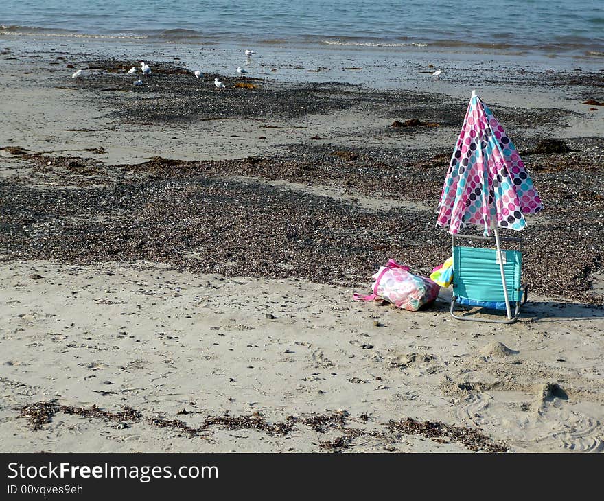 The lonely chair and umbrella