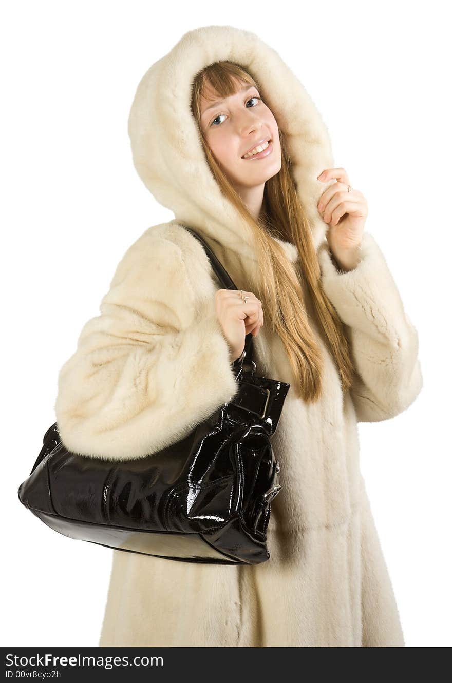 Pretty young girl in fur jacket taking bag