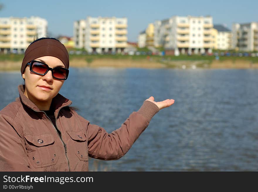 Attractive and happy brunette woman showing her new apartment. Attractive and happy brunette woman showing her new apartment