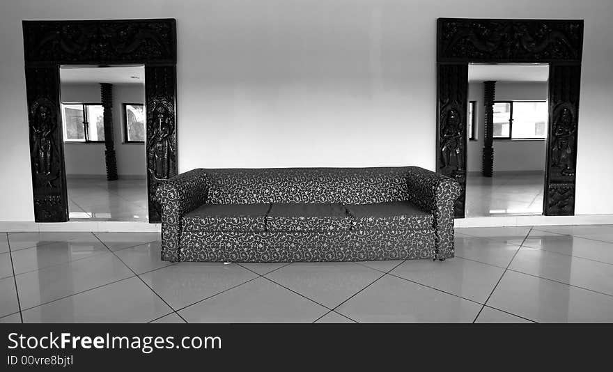 Sofa and mirrors in hall of hotel