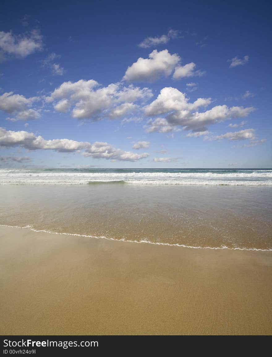 A golden sandy beach is washed by the warm Atlantic tide. A golden sandy beach is washed by the warm Atlantic tide.