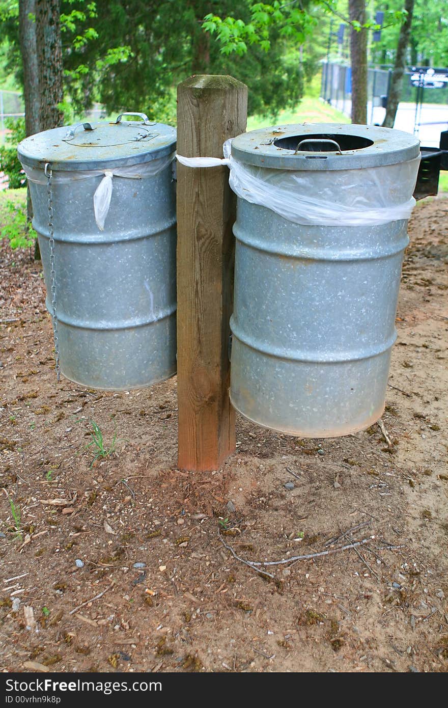 Two garbage cans in the park. Two garbage cans in the park