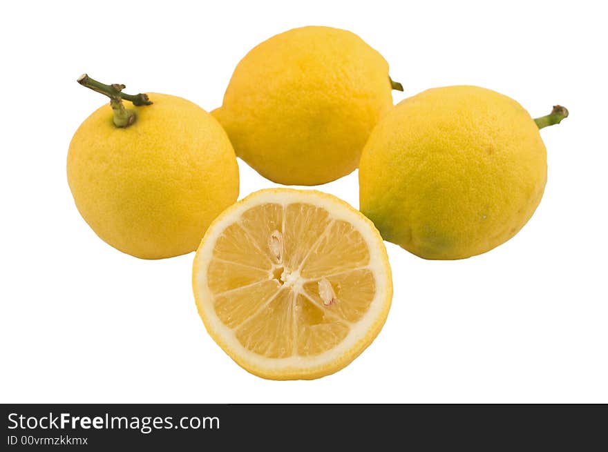 Three lemons and a half isolated on white