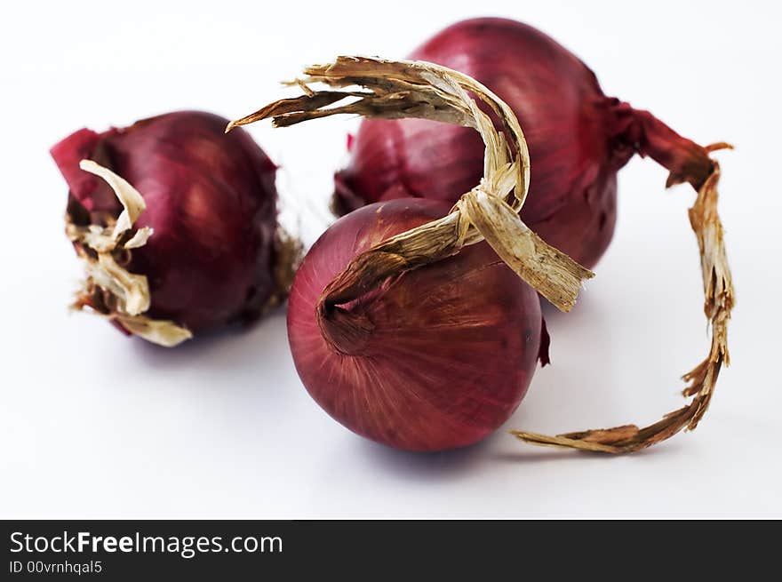 Three red onion isolated on white. Three red onion isolated on white