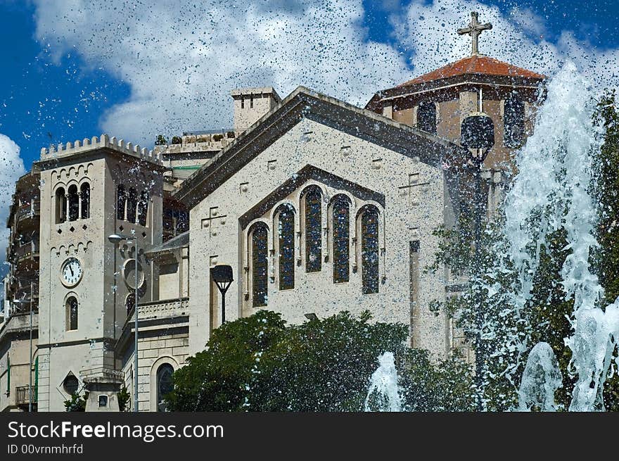 Church with fountain sprays on sunny day. Church with fountain sprays on sunny day