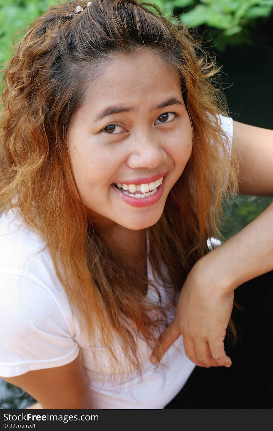 Close-up portrait of a happy Thai woman. Close-up portrait of a happy Thai woman.