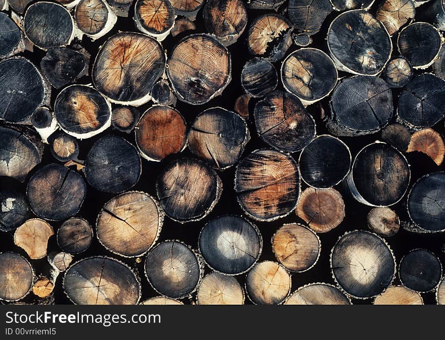 Fire wood stacked up and stored for the season. Fire wood stacked up and stored for the season