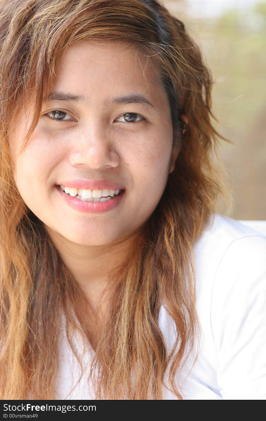 Close-up portrait of a cute young Asian girl. Close-up portrait of a cute young Asian girl.