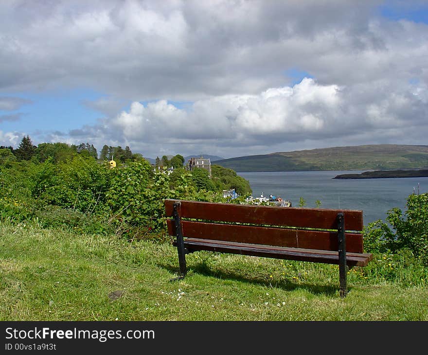 Isolated bench on a hill, overlooking the village of Tobermory. great view. Isolated bench on a hill, overlooking the village of Tobermory. great view