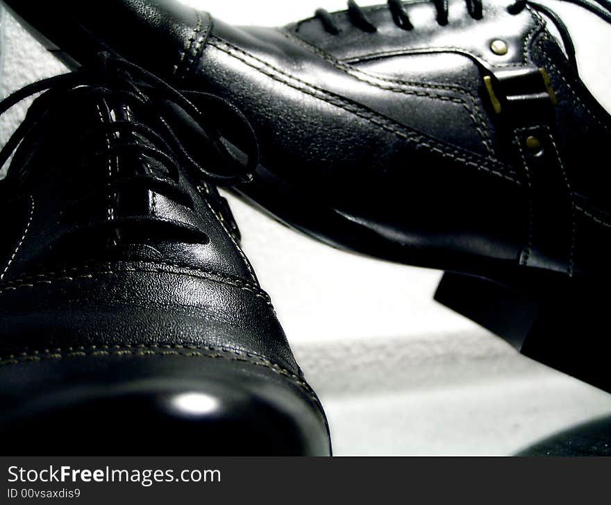 Advertising photo, man's black boots, studio, light the goods. Advertising photo, man's black boots, studio, light the goods.