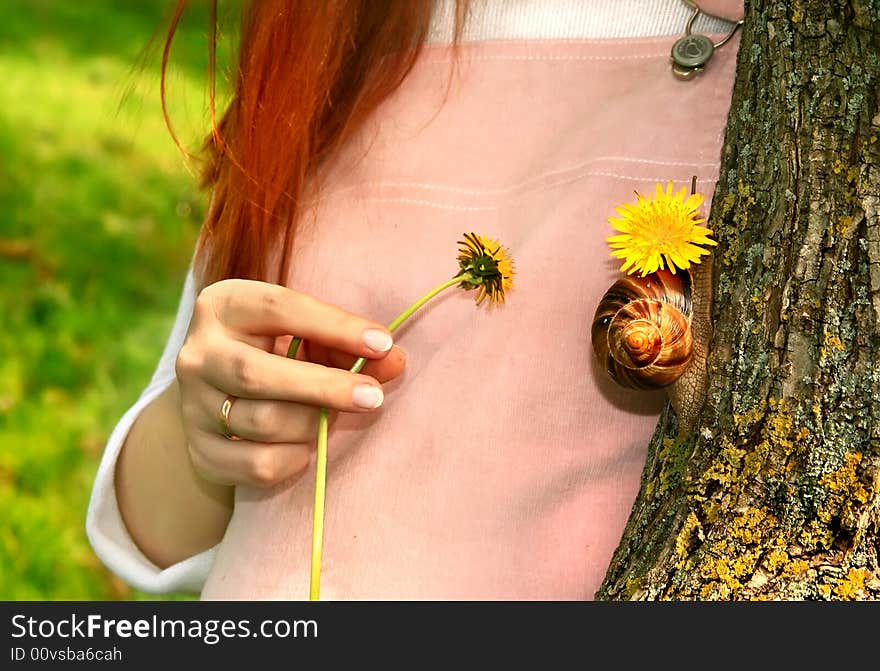 Beautiful and young pregnant girl walks on spring park: a good illustration for magazine about pregnant women and for women