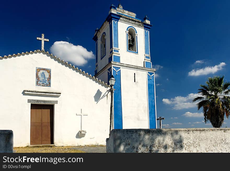 Portugal, Alentejo: Chapel near evora; blue sky and white and blue walls for this ancient religious construction typical from the south of portugal