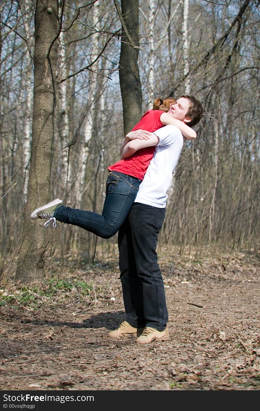 A young lady is carried by her husband. A young lady is carried by her husband