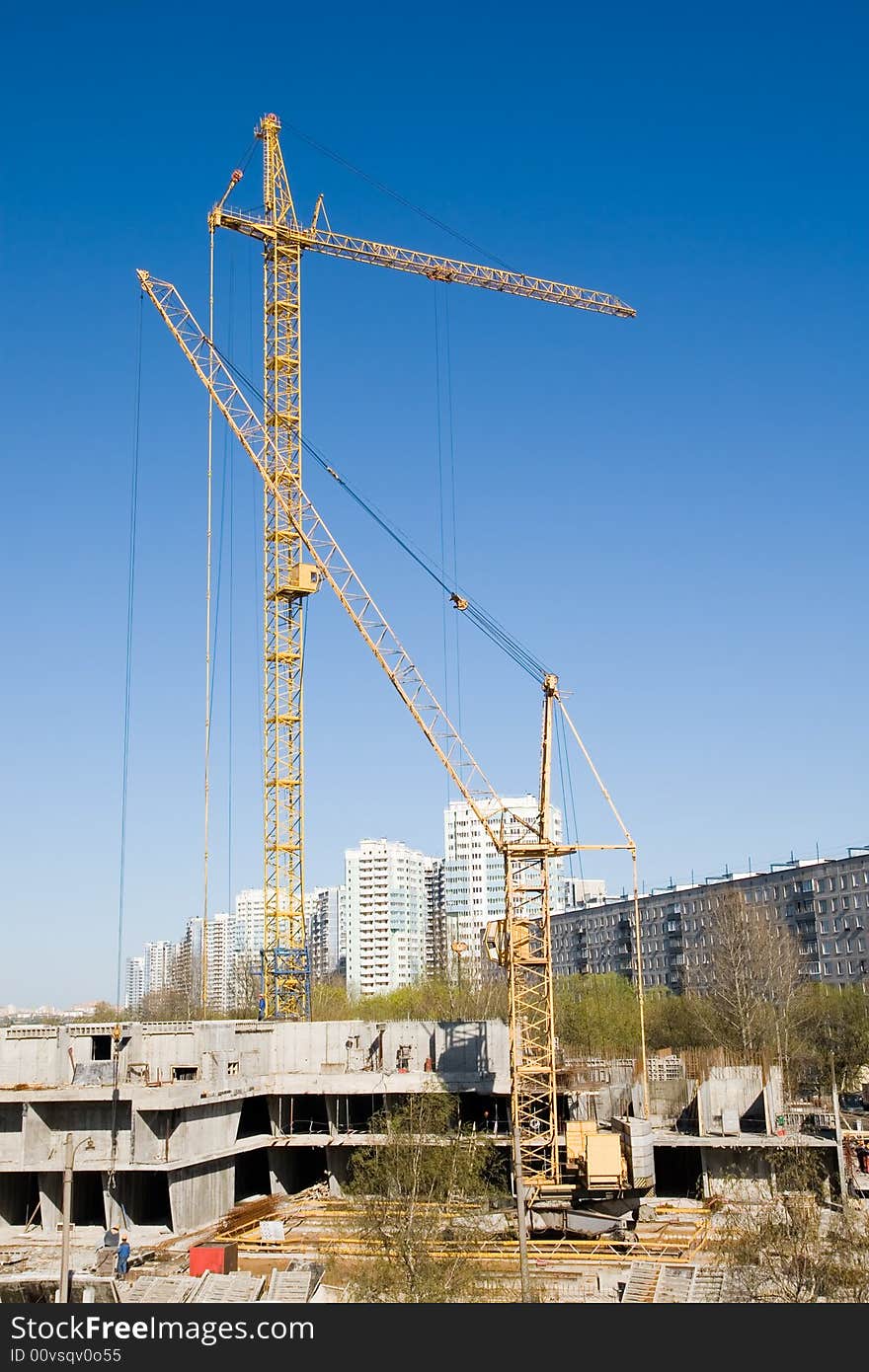 Cranes working on a building site in city. Cranes working on a building site in city