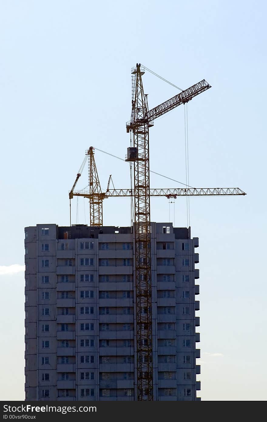 Cranes working on a building site in city. Cranes working on a building site in city