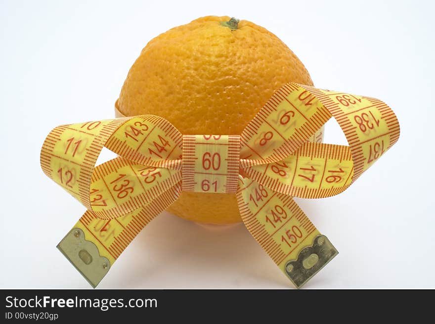 Orange with measuring tape. White background. Orange with measuring tape. White background.