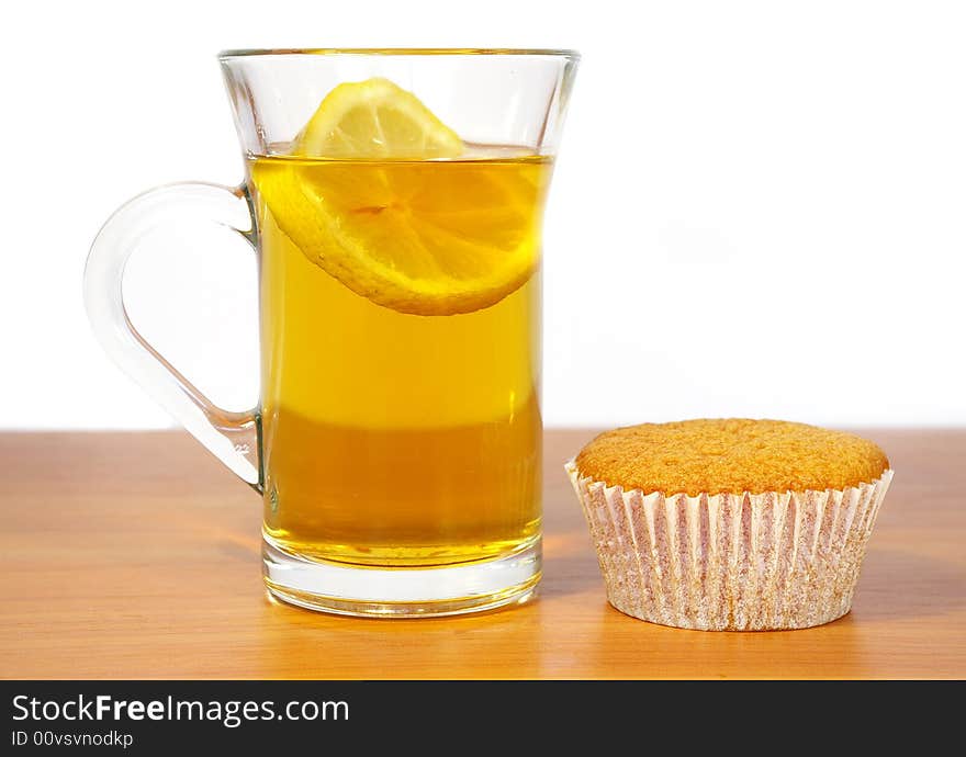 Cakes and the cup of tea on the  white background. Cakes and the cup of tea on the  white background