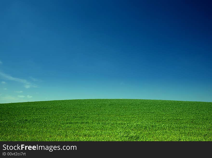 An image of sky over green field. An image of sky over green field