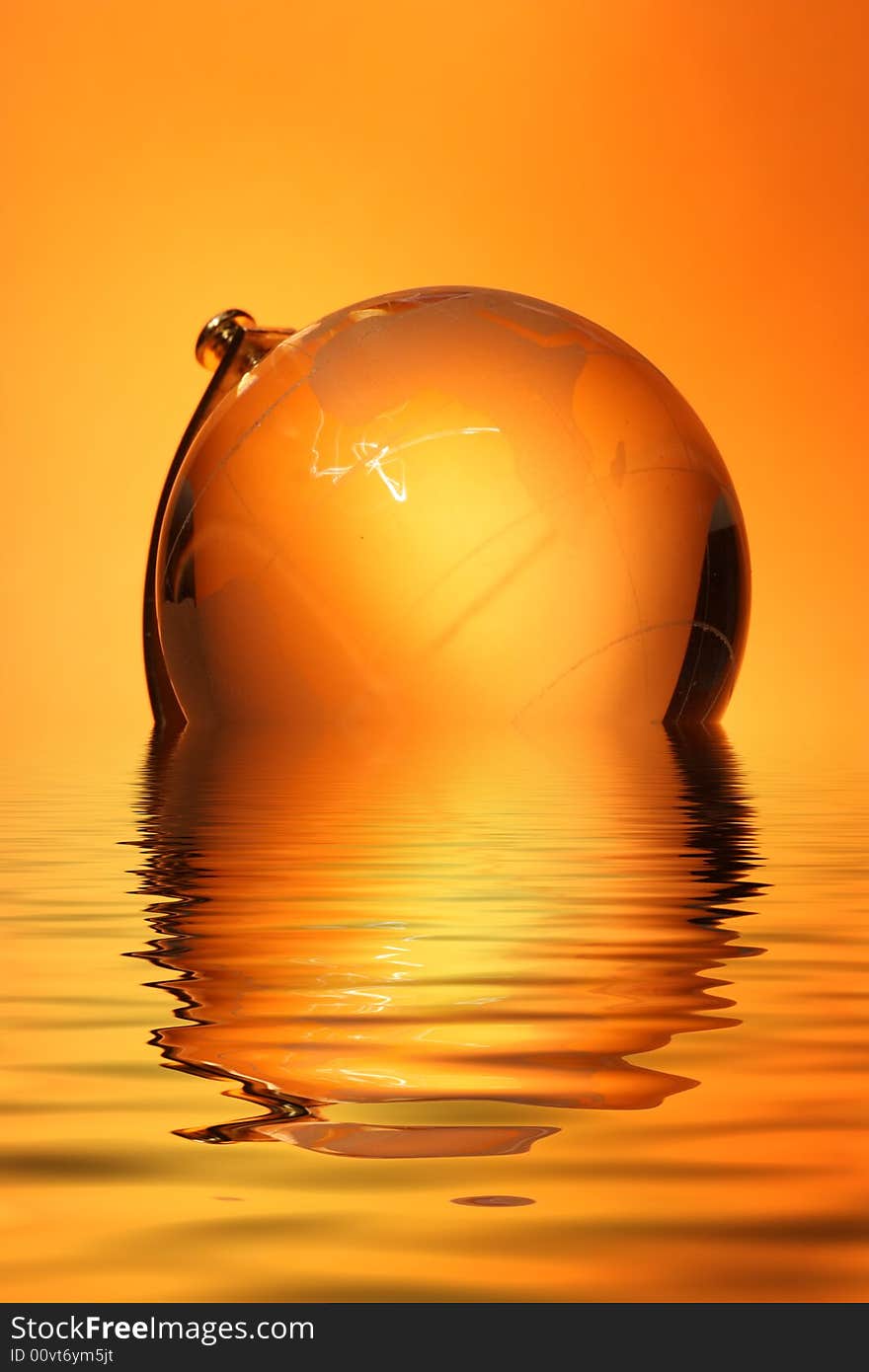 Glass globe with reflection in water