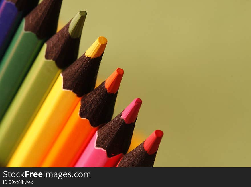 A part of pencils with a simple green background. A part of pencils with a simple green background