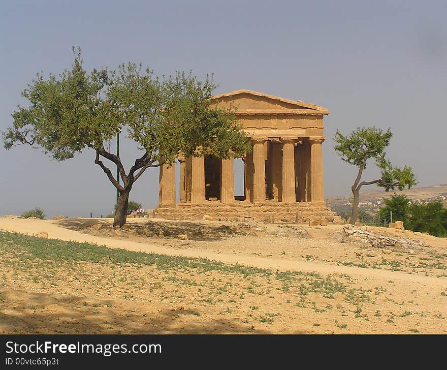 The ancient temple of concordia standing near the modern town of Agrigento