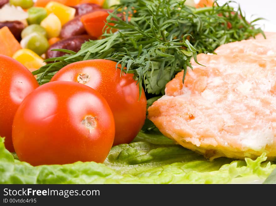 Stake from a salmon with vegetables on a plate