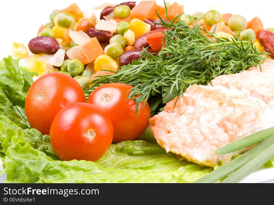 Stake from a salmon with vegetables on a plate