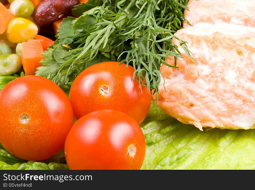 Stake from a salmon with vegetables on a plate