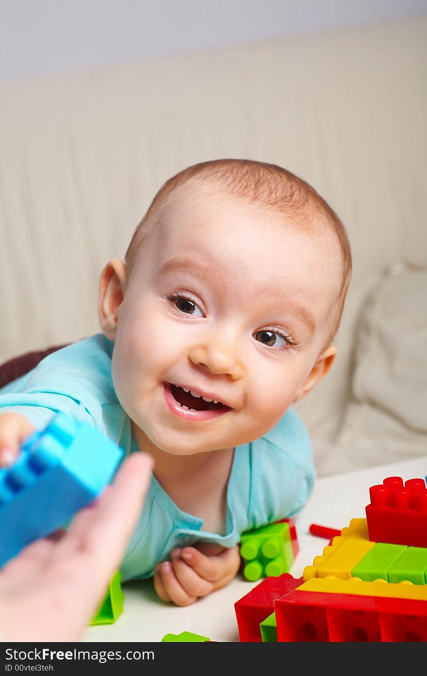 Portrait of  young baby girl with toys. Portrait of  young baby girl with toys