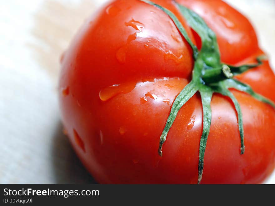 Close up to Fresh Tomato on cutting board