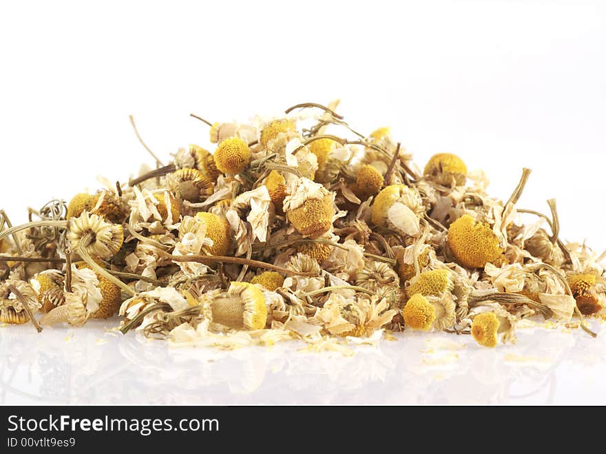 Dried chamomile on a white background. Dried chamomile on a white background.