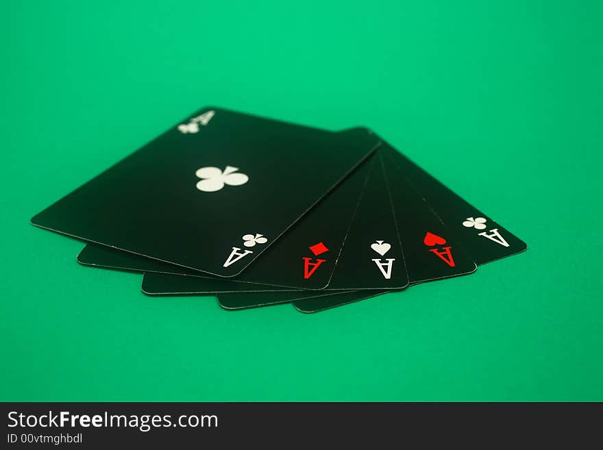 A great hand in a poker game with a green background. A great hand in a poker game with a green background.