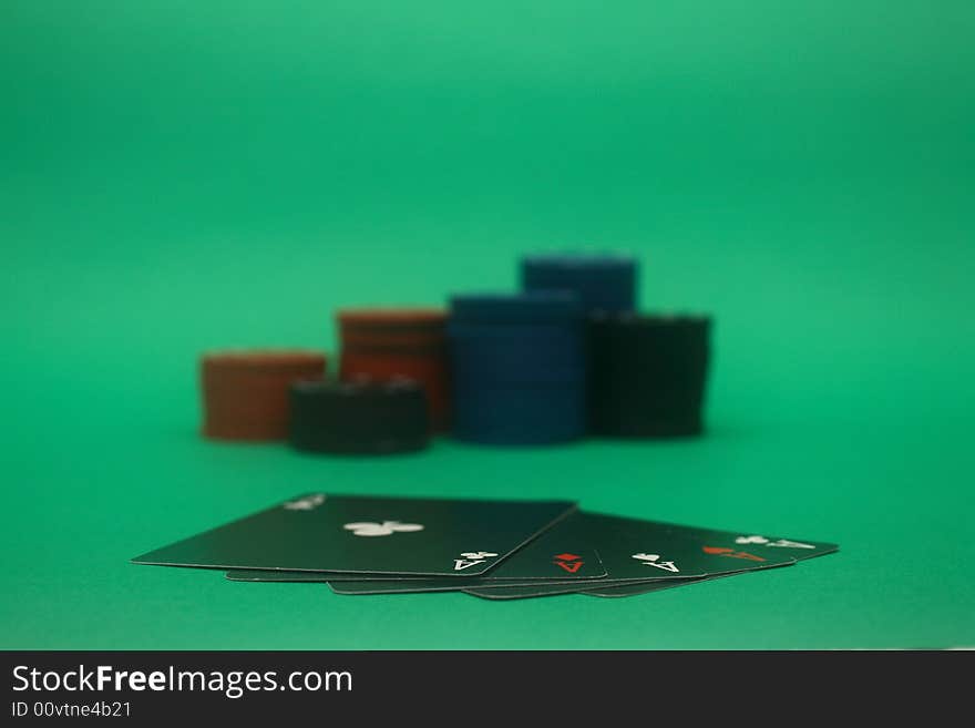 A great hand in a poker game with a green background. A great hand in a poker game with a green background.