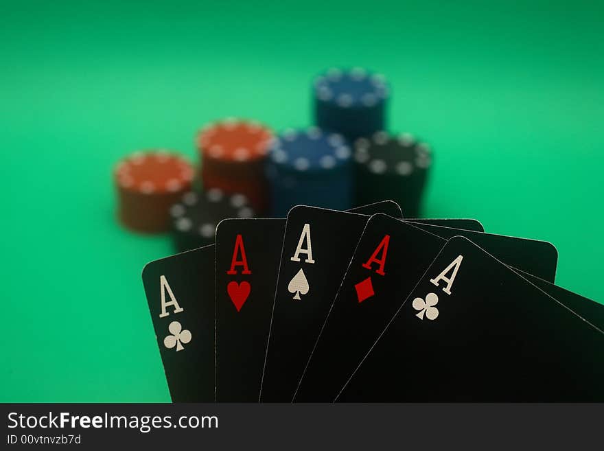 A great hand in a poker game with a green background. A great hand in a poker game with a green background.