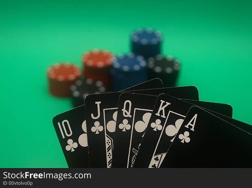 A great hand in a poker game with a green background. A great hand in a poker game with a green background.