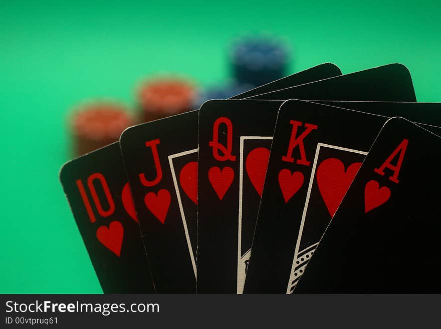 A great hand in a poker game with a green background. A great hand in a poker game with a green background.