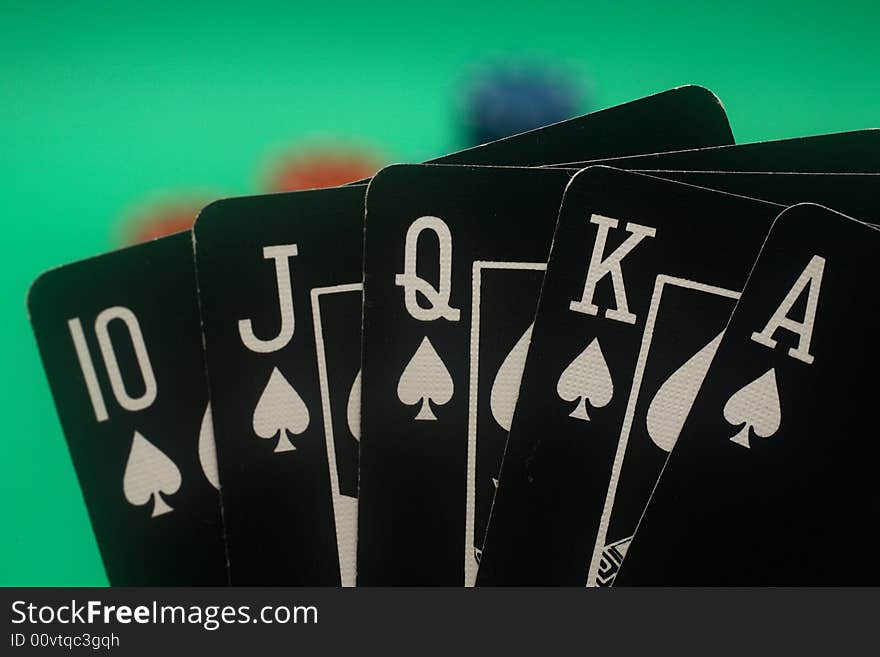 A great hand in a poker game with a green background. A great hand in a poker game with a green background.