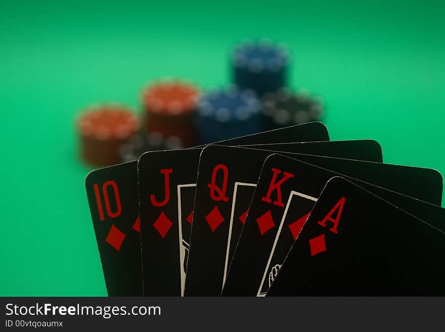 A great hand in a poker game with a green background. A great hand in a poker game with a green background.