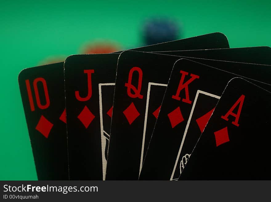 A great hand in a poker game with a green background. A great hand in a poker game with a green background.