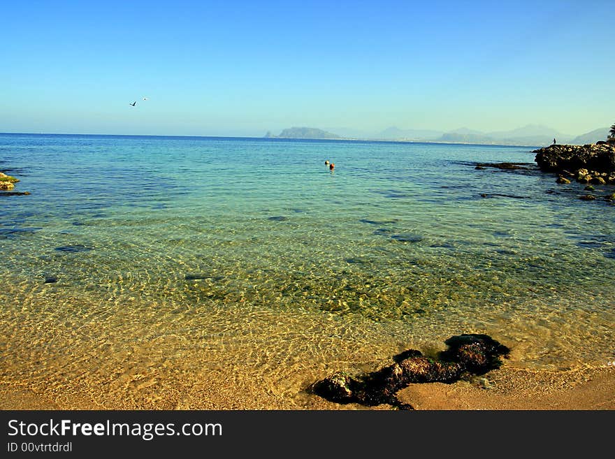 Blue sea wather nuances . Seascape of blue mediterranean sea and coast, Island of Sicily, Italy. Blue sea wather nuances . Seascape of blue mediterranean sea and coast, Island of Sicily, Italy