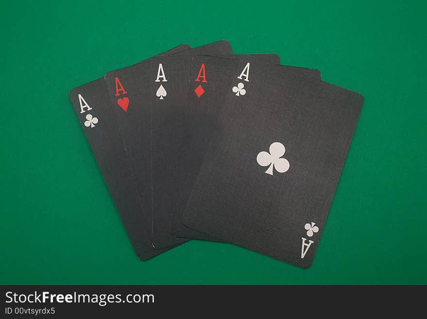 A great hand in a poker game with a green background. A great hand in a poker game with a green background.