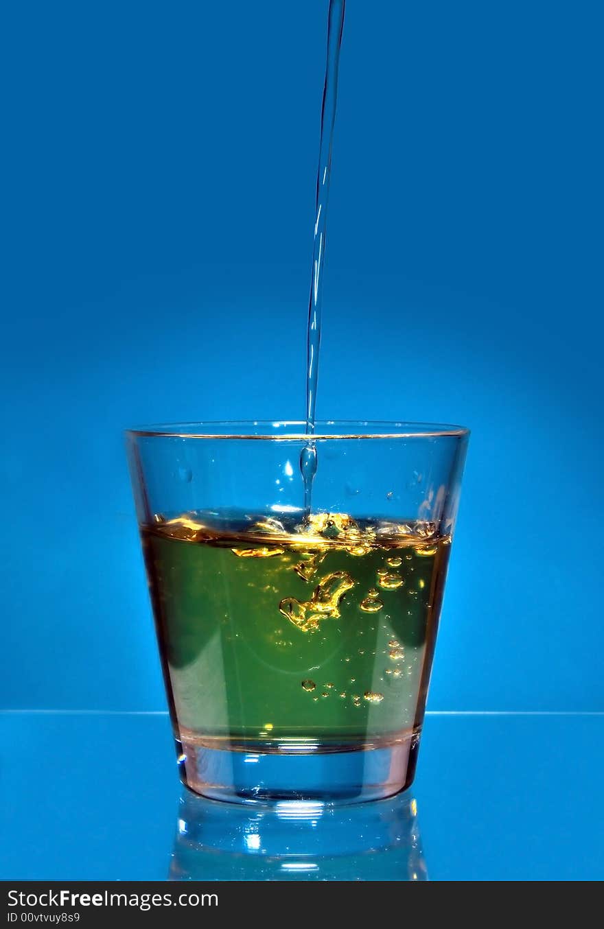 Drink splash at the top of a glass