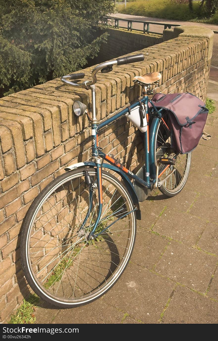 City bike leaning against a bridge boundary