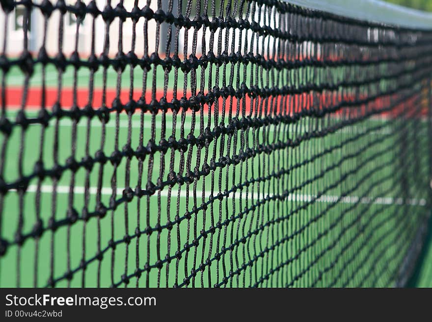 Yellow tennis ball on a green court. Yellow tennis ball on a green court